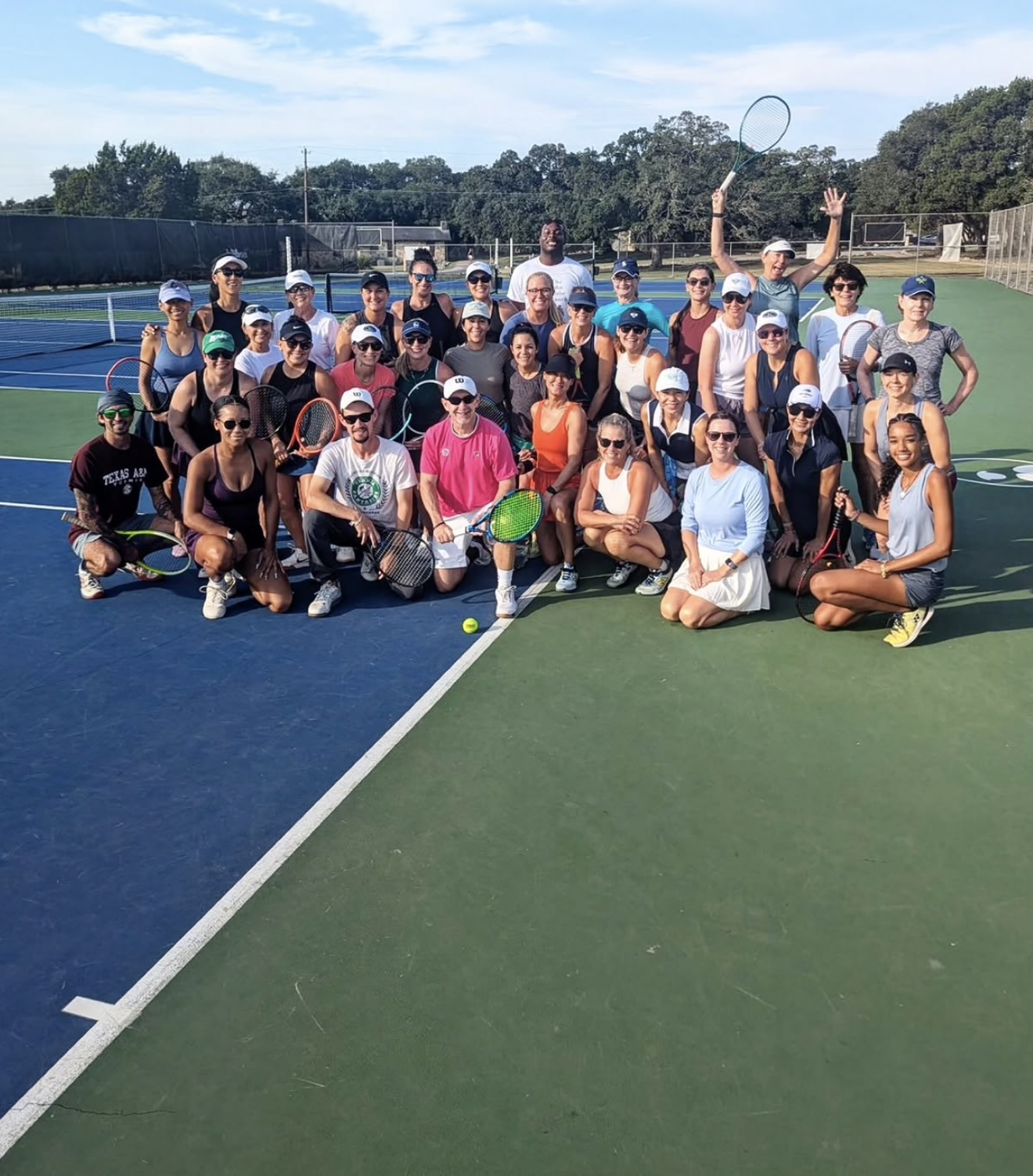 Rally Haus community group on court after a clinic